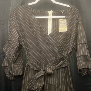 New with tags black with tan pin striped size Med love J romper